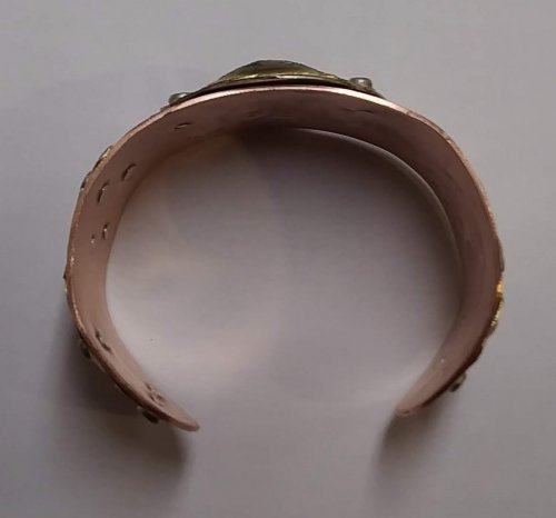 Judy Larson's Fold Formed Cuff With Faux Roman Glass or Coin Cabochon - , Metalwork, Cutting, Cutting Tool, Cutters, Dapping, Dapping Jewelry, Filing, Finishing, Forging, Forging Jewelry, Jewelry Forging, How To Punch Holes, Hole Punching, Punch A Hole, Oxidizing Wire, Oxidizing, Antiquing Wire, Antiquing, Riveting, Riveting Techniques, Wire Rivets, Sawing, Saw, Wire Saw, Texturing, Drilling, Drill, Fold Formed Faux Roman Glass Cuff